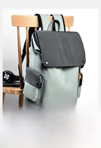 Detail view of the durable contrast fabric and side zipper pocket on a casual backpack