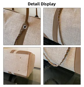 Detail view of large canvas tote bag with woven texture, PU leather handles and metal feet