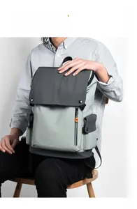 Detail view of stylish color-block backpack with flap cover and functional side pockets