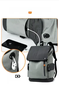 Detail of laptop backpack showing external USB charging port and headphone jack interface