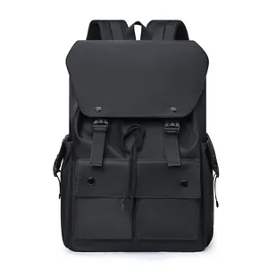 Front detail of black nylon backpack featuring flap closure and dual adjustable buckles