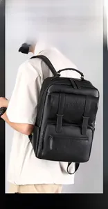 Detailed view of black pebbled PU leather backpack with double strap front pocket