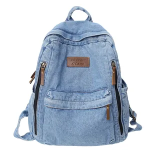 Gerecycled blauwe denim rugzak met leren label en diverse handige ritszakken voor reizen