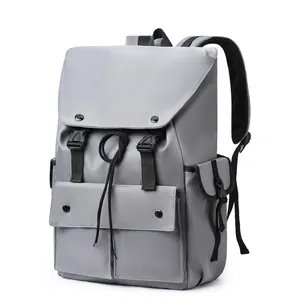 Light grey nylon backpack with multi-pocket layout and buckle closure for 15.6 inch laptop