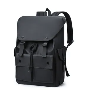 Detailed view of water-resistant black nylon backpack with flap buckle and mesh straps