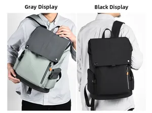 Side-by-side comparison of grey and black outdoor backpacks with flap closure and metal buckles