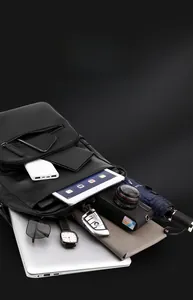 Spacious black pebble leather backpack with multiple compartments for laptops and gadgets