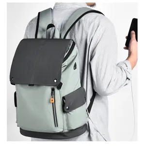 Close-up of side view commuter backpack with external USB charging port and orange zipper