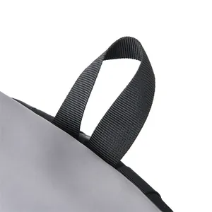 Close-up of durable nylon backpack with reinforced black woven loop and neat stitching