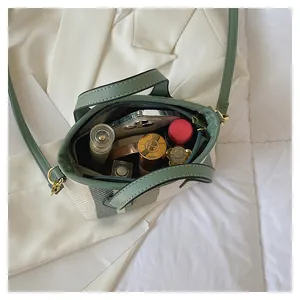 Top view of striped bucket bag interior showing spacious storage for daily essentials