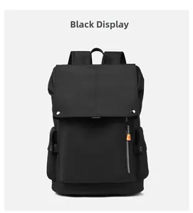 Detail view of black waterproof business backpack with flap top and metallic buckles