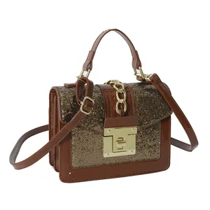 Elegant brown crossbody bag with gold sequins, flap closure and polished metal chain