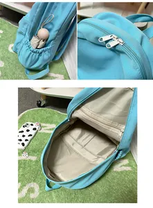 Detail of sky blue backpack with side pocket for umbrella and large interior compartments