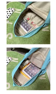 Macro detail of the spacious light blue backpack interior with laptop compartment and mesh pocket