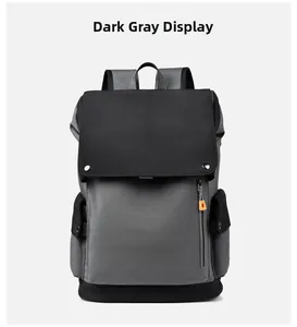 Front detail of dark grey dual-tone laptop backpack with orange zipper puller