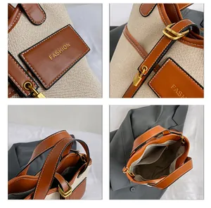 Detail view of canvas bucket bag with brown leather trim, gold lock and fashion hardware