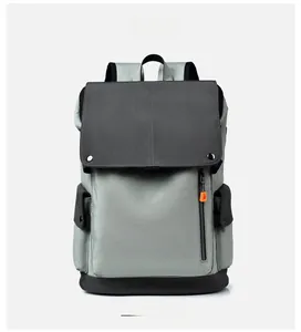 Front detail of waterproof casual backpack in grey with flap cover and side pockets