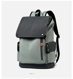 Side view of outdoor business backpack featuring flap cover and orange zipper accents