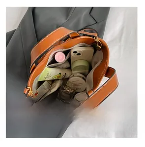 Top view of caramel leather bucket bag interior showing spacious capacity and lining