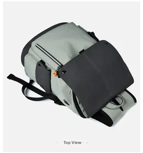 Top view of leisure backpack with orange zipper pulls and side snap pocket details