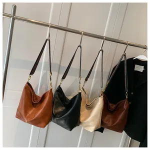 Detailed display of tote bags in four colors with ethnic style patterned shoulder straps