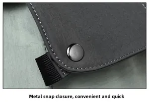 Detail of metal snap button closure with nylon webbing and contrast stitching on backpack