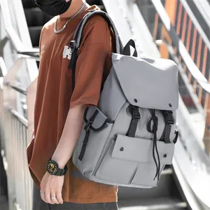 Detail of grey waterproof nylon backpack with flap cover and buckle closure