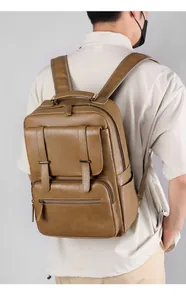 Side view of brown leather business backpack featuring textured PU and padded straps