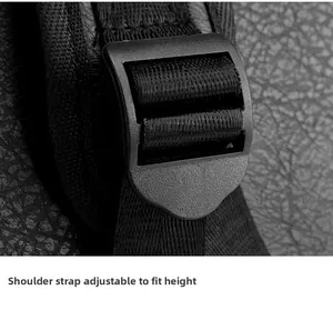 Close-up of adjustable nylon shoulder strap and plastic buckle on leather backpack