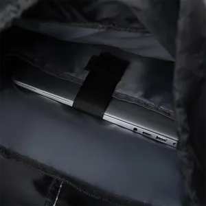 Detail view of the 15.6 inch laptop compartment with secure elastic velcro strap inside