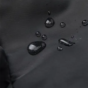 Macro detail of high-density waterproof nylon fabric with clear rolling water droplets
