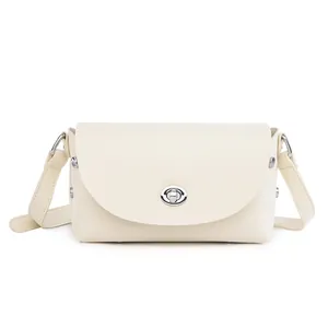 Minimalist cream white crossbody bag with silver oval twist lock and smooth faux leather
