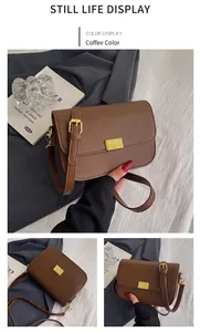 Close-up of retro brown crossbody bag with gold buckle and adjustable strap details