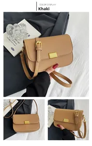 Detail of khaki PU leather crossbody bag with adjustable strap and gold buckle closure