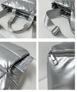 Detailed close-up of shiny silver quilted tote bag with metal zipper and strap details