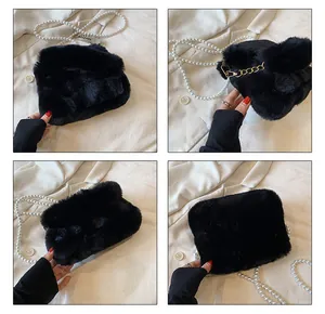Detail view of black faux fur bag featuring a pearl chain strap and soft fluffy texture