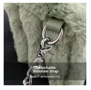 Detail of the light green faux fur bag featuring a detachable silver metal shoulder strap