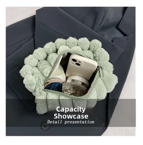 Interior view of light green plush handbag showing capacity for phone and cosmetics