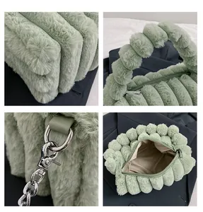 Detail view of sage green plush handbag featuring quilted stripes and fuzzy round handle