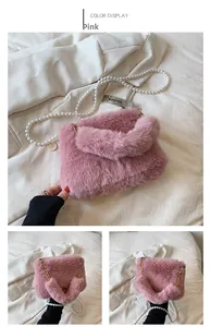 Detailed close-up of pink faux fur texture and elegant pearl strap on a square bag