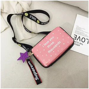 Pink heart camera bag with I Love You print and graphic wide strap detail view