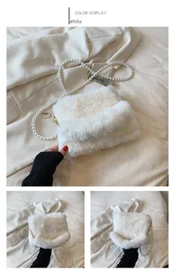 Close-up of white plush faux fur crossbody bag with elegant large faux pearl chain strap