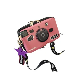 Pink retro camera shaped crossbody bag with fashion print and wide smile strap