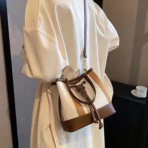 Vintage canvas and leather bucket bag with contrast stripes for women commute fashion