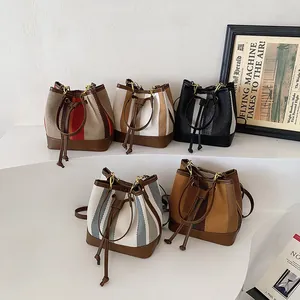 Vintage striped canvas bucket bags with faux leather trim and drawstring closure