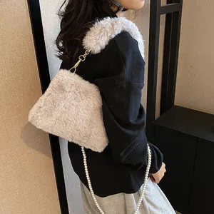 Chic beige faux fur crossbody bag with elegant pearl chain strap for women winter fashion