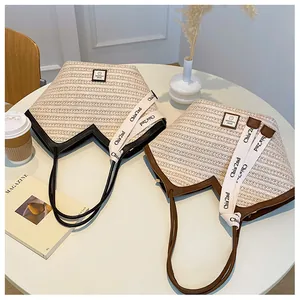 Close-up of woven tote bags with V-shaped opening and sport fashion logo detail