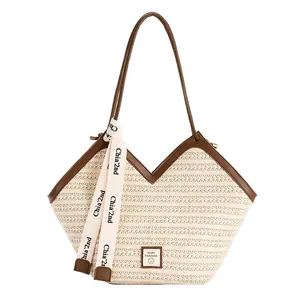 Beige large capacity woven tote bag with V-shaped opening and brown leather straps