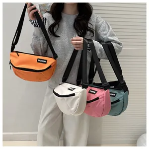 Multiple colorful nylon crossbody bags with adjustable straps shown in various vibrant shades