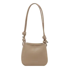 Minimalist vintage khaki shoulder bag with knot detail and silver fashion text